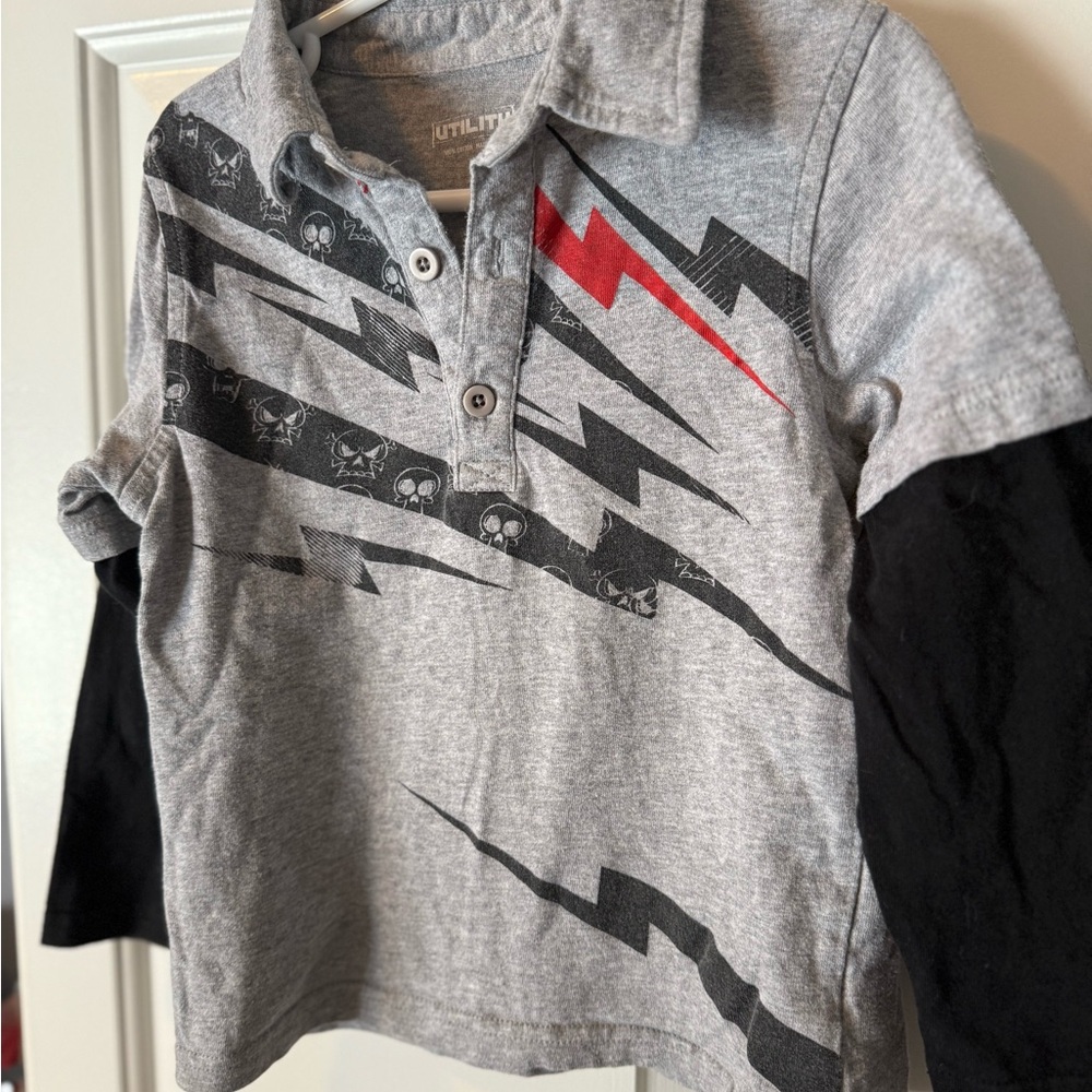 4T Kids long sleeve polo with Lightning and skull and bones design.